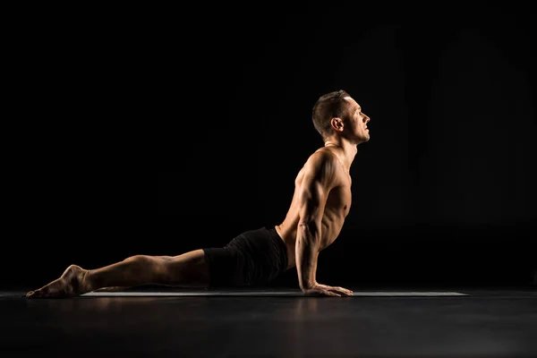 Man doing yoga cobra pose