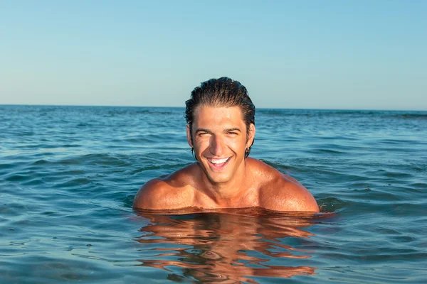 Cool man in his thirties in the sea