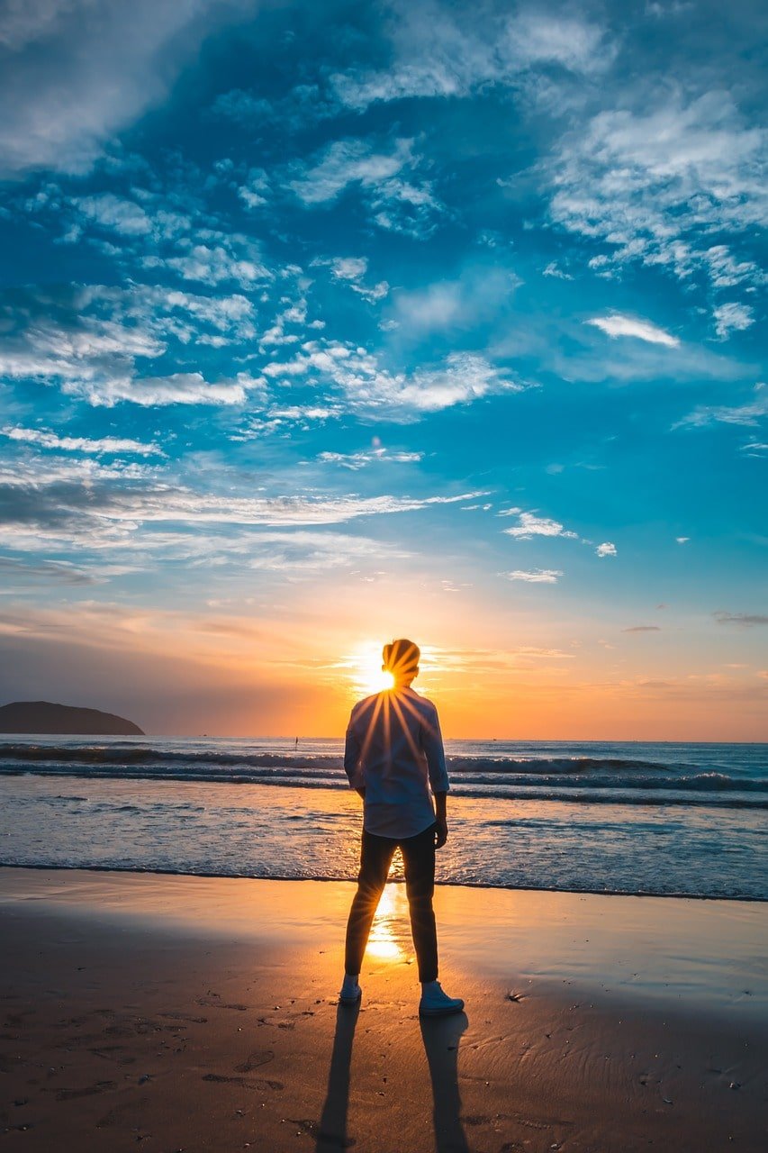 Guy at sunset looking at sun
