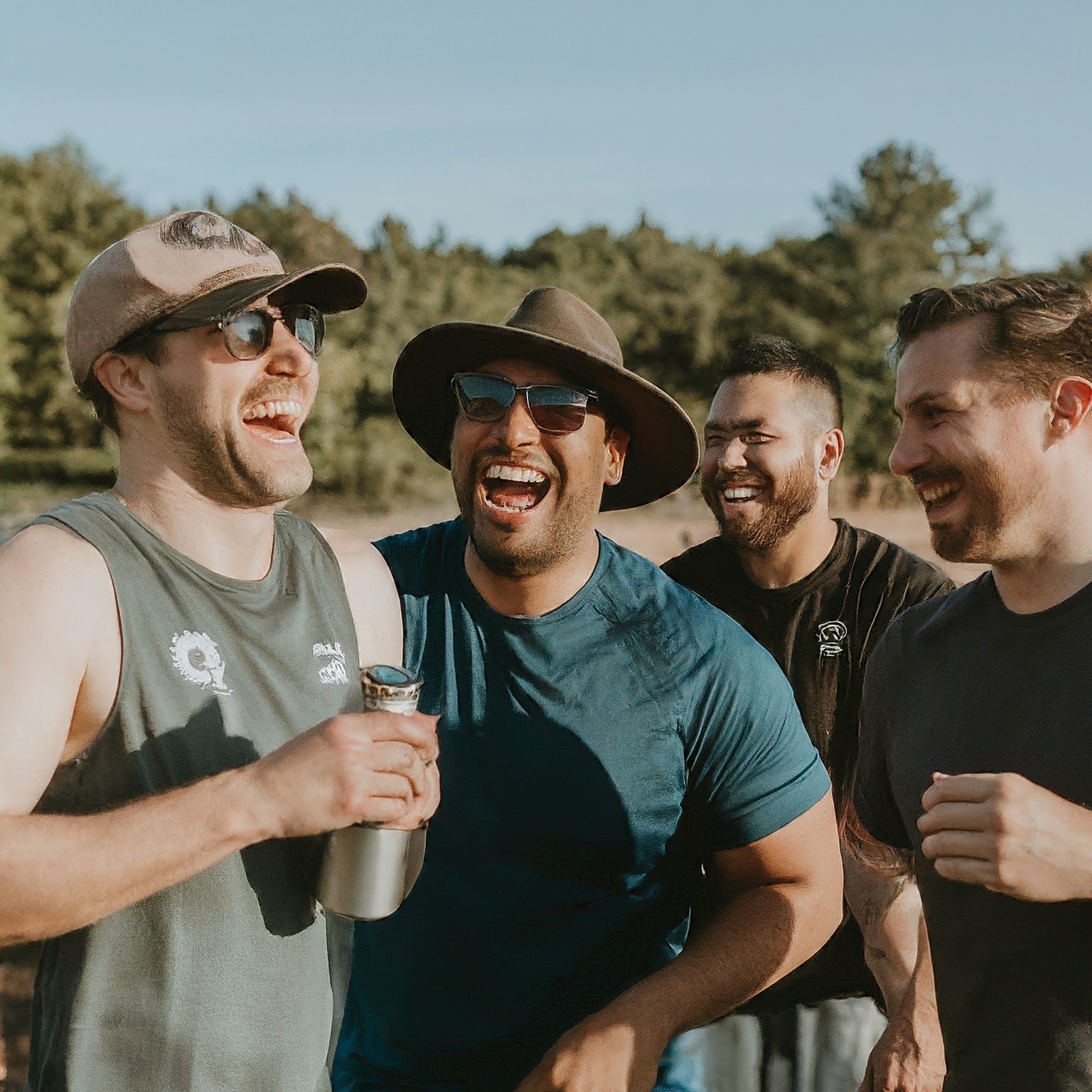 Guys laughing in the sun