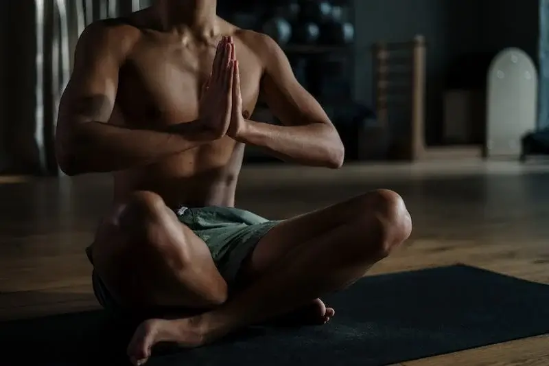 Man doing meditative yoga pose