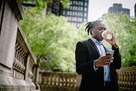 Man drinking coffee during his break