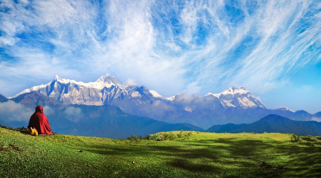 Monk overlooking himalayas